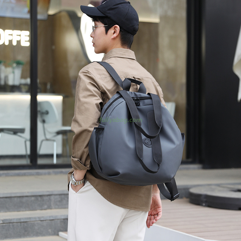 Factory Wholesale Men Women PU Waterproof Hand Carry Double Shoulder School Bags Casual Sports Round Travel Backpack