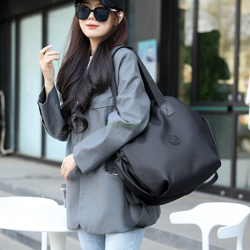 Factory Wholesale Men Women PU Waterproof Hand Carry Double Shoulder School Bags Casual Sports Round Travel Backpack